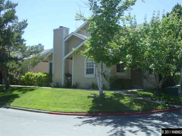 6020 Conness Way Reno, NV 89523 - Photo 1 of 9 a view of a house with a yard and large trees