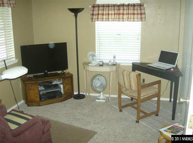6020 Conness Way Reno, NV 89523 - Photo 4 of 9 a view of a livingroom with furniture and a flat screen tv