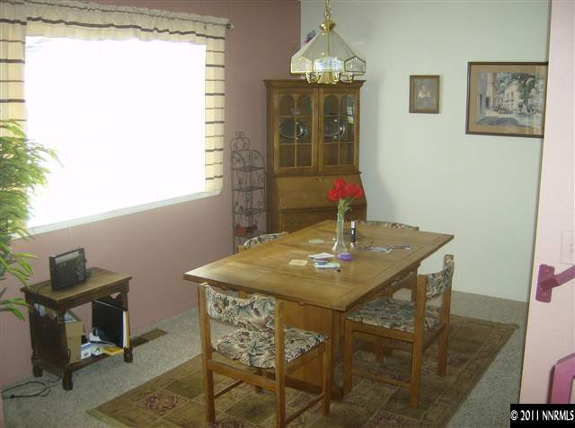 6020 Conness Way Reno, NV 89523 - Photo 5 of 9 a view of a dining room with furniture and chandelier