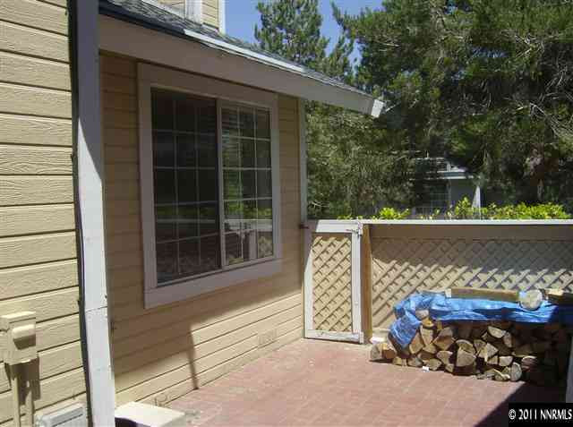 6020 Conness Way Reno, NV 89523 - Photo 9 of 9 a wooden bench sitting in front of a building