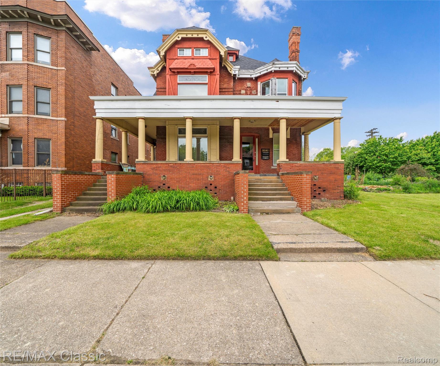 3941 Trumbull Detroit, MI 48208 - Photo 1 of 46 Brick exterior with a covered porch featuring multiple columns