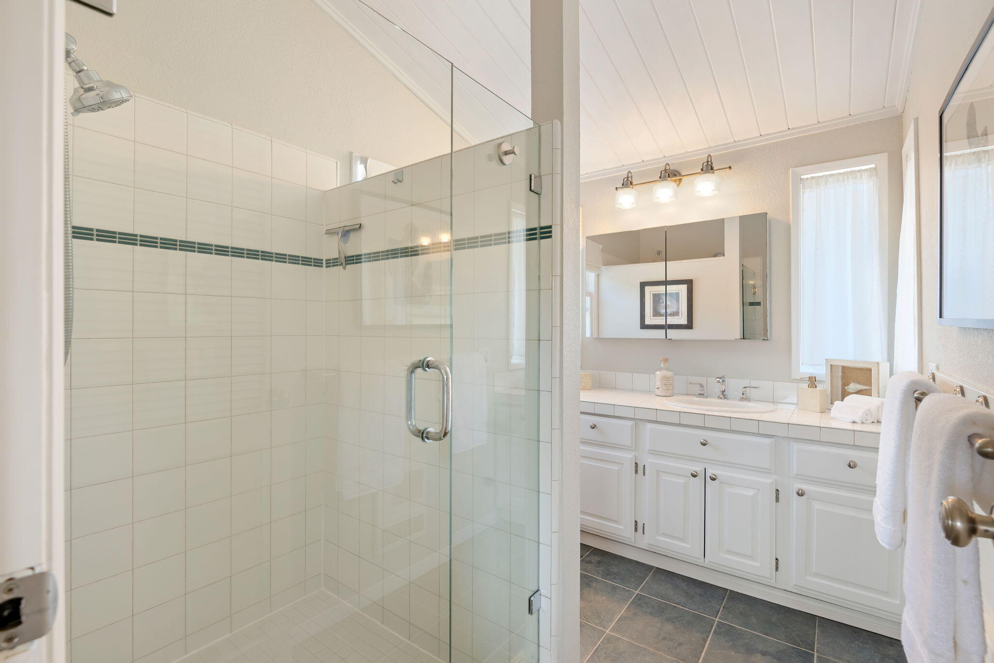 2129 Red Rose Way Santa Barbara, CA 93109 - Photo 21 of 44 a bathroom with a double vanity sink mirror and shower