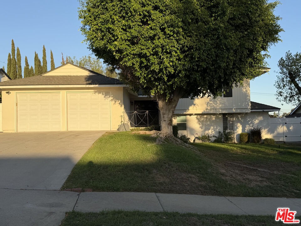 a front view of a house with yard