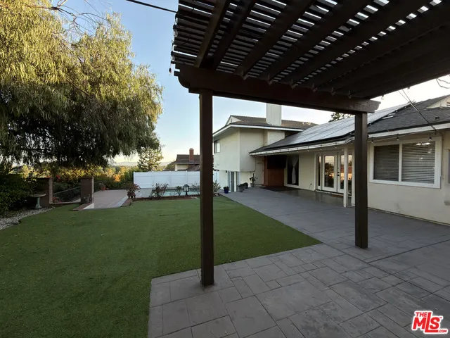 a view of a porch and garden