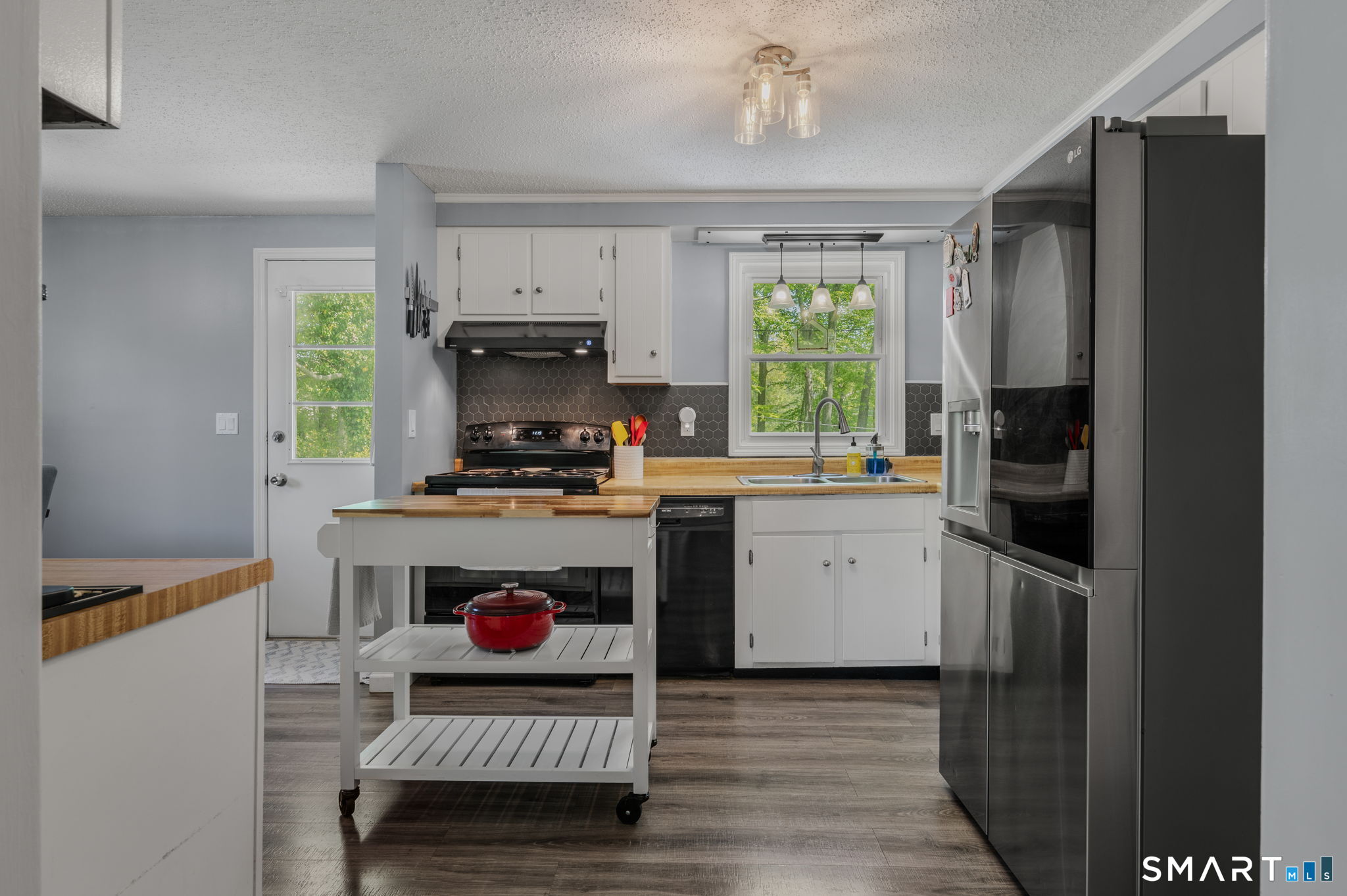 6 Amherst Court Groton, CT 06355 - Photo 8 of 40 a kitchen with a refrigerator and a stove