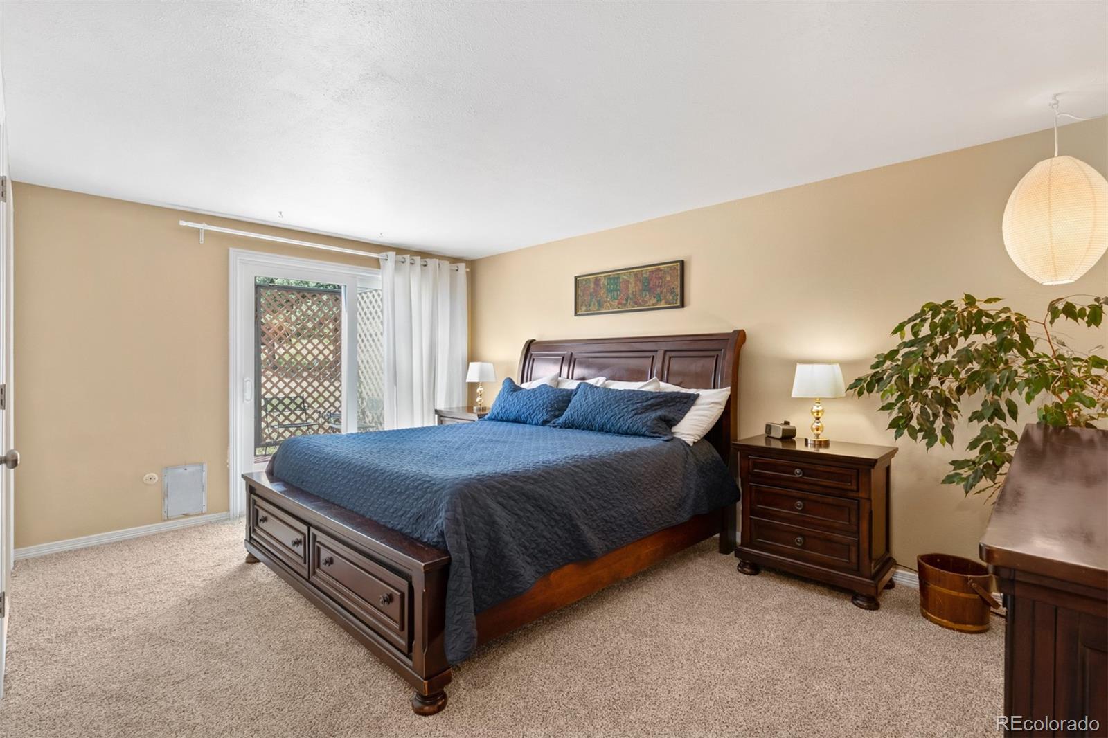 6637 High Drive Morrison, CO 80465 - Photo 13 of 28 a bed sitting in a bedroom and dresser
