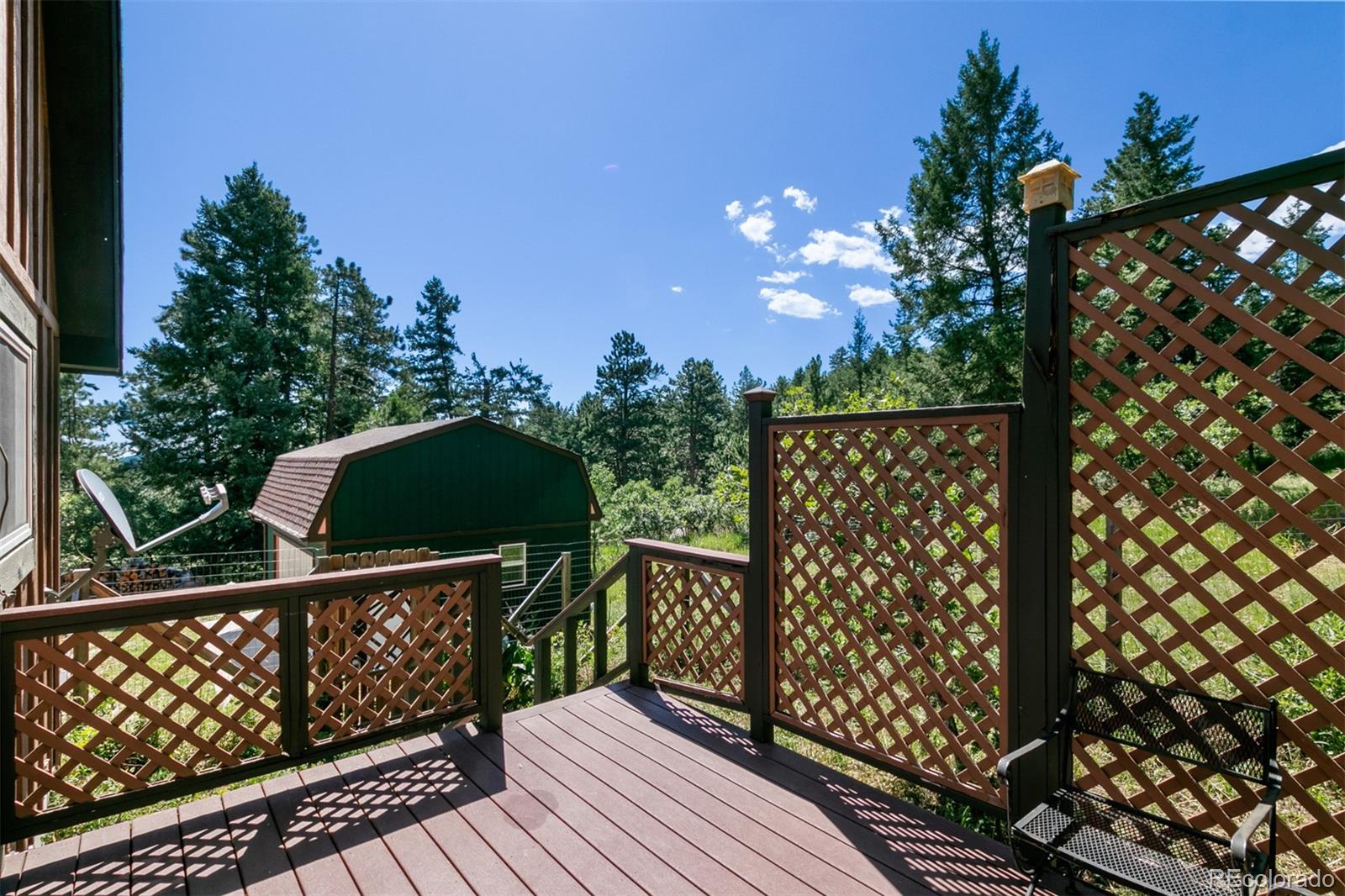 6637 High Drive Morrison, CO 80465 - Photo 23 of 28 a balcony with wooden floor and fence