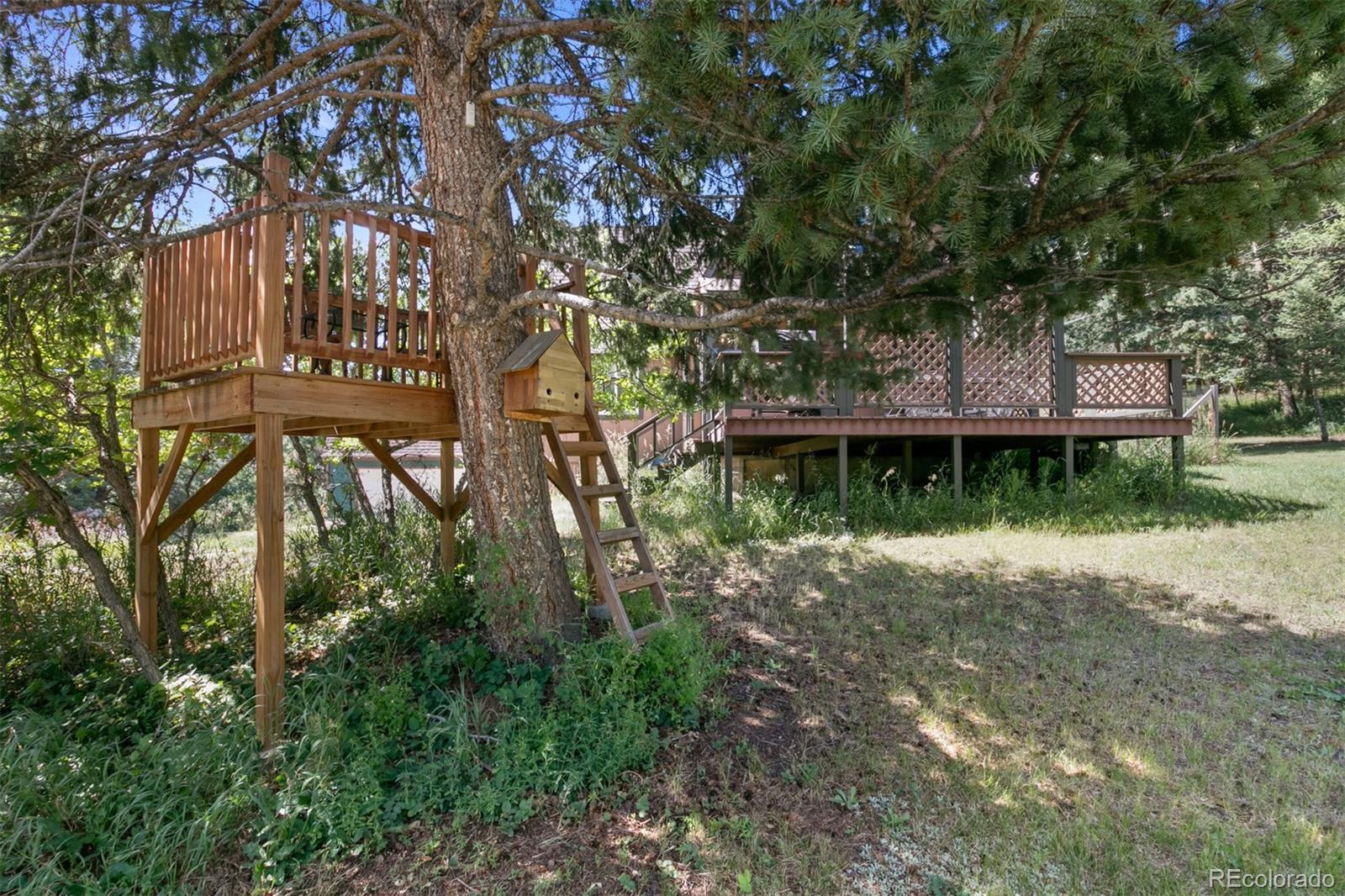 6637 High Drive Morrison, CO 80465 - Photo 25 of 28 a view of a house with a yard
