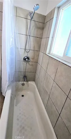 a bathroom with a sink and a shower