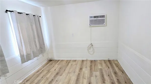 a view of a door with wooden floor