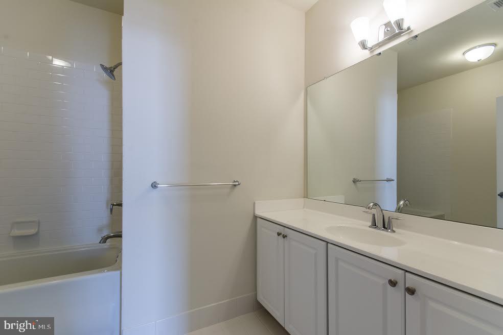 600 South 24th Street, Unit 213 Philadelphia, PA 19146 - Photo 11 of 19 a bathroom with a sink and a mirror