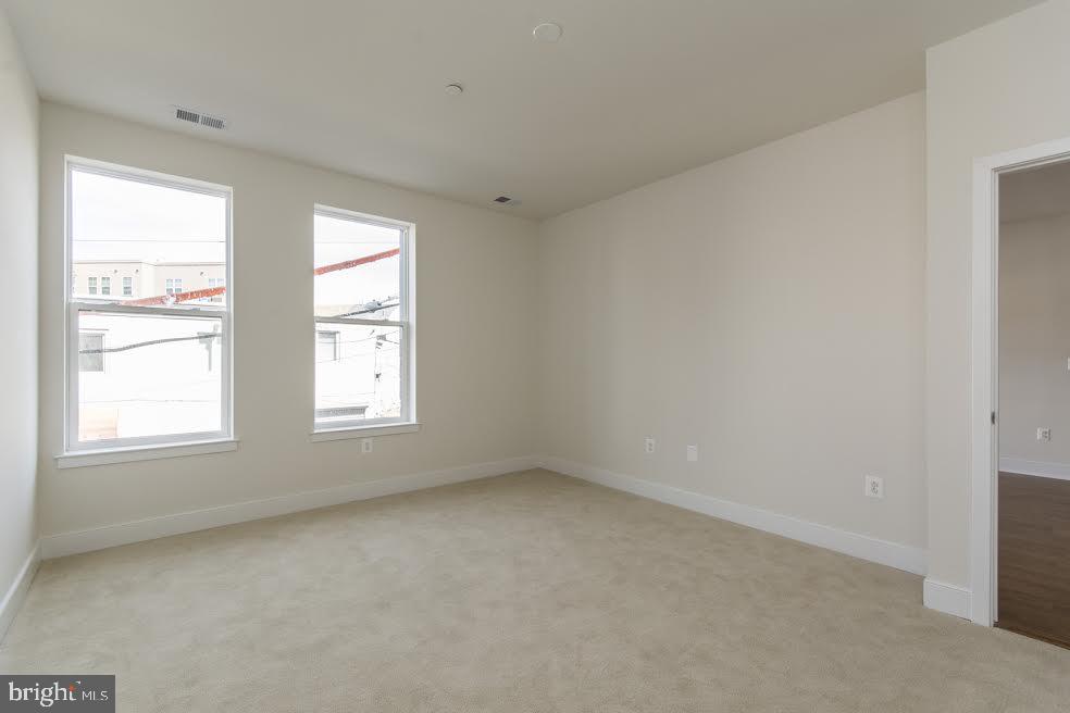 600 South 24th Street, Unit 213 Philadelphia, PA 19146 - Photo 13 of 19 an empty room with windows