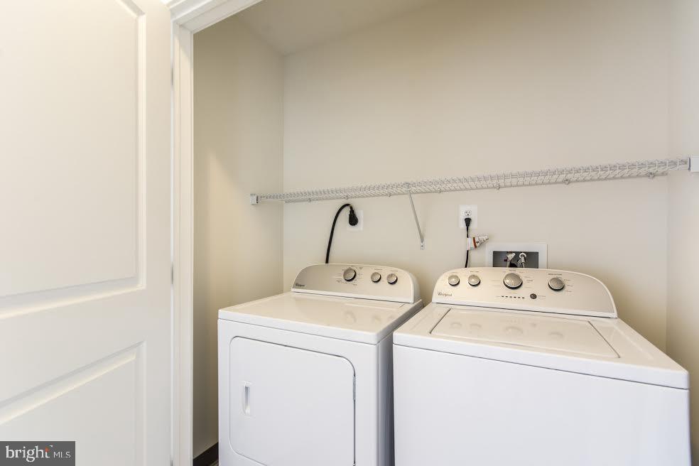 600 South 24th Street, Unit 213 Philadelphia, PA 19146 - Photo 16 of 19 a utility room with dryer and washer