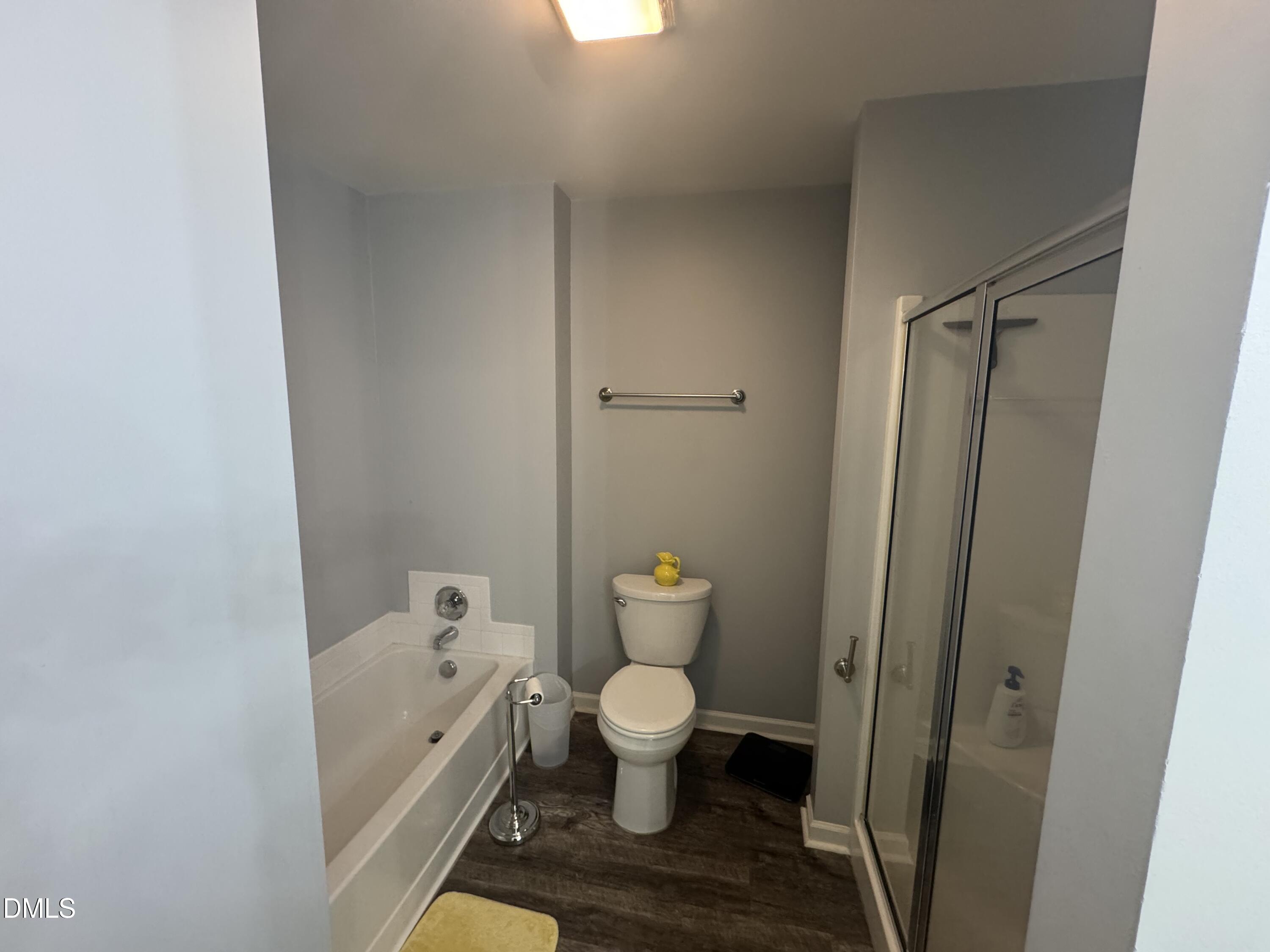 11351 Clubhaven Place, Unit 100 Raleigh, NC 27617 - Photo 19 of 29 a bathroom with a toilet and a shower