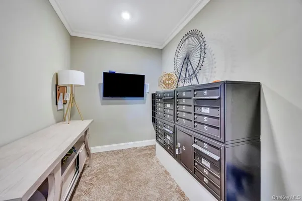 a kitchen with stainless steel appliances kitchen island granite countertop white cabinets and window