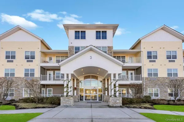 a front view of a large white building