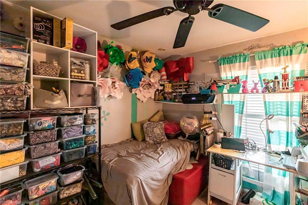 2900 8th Street Southwest Lehigh Acres, FL 33976 - Photo 21 of 32 a view of a chairs and toys in a room