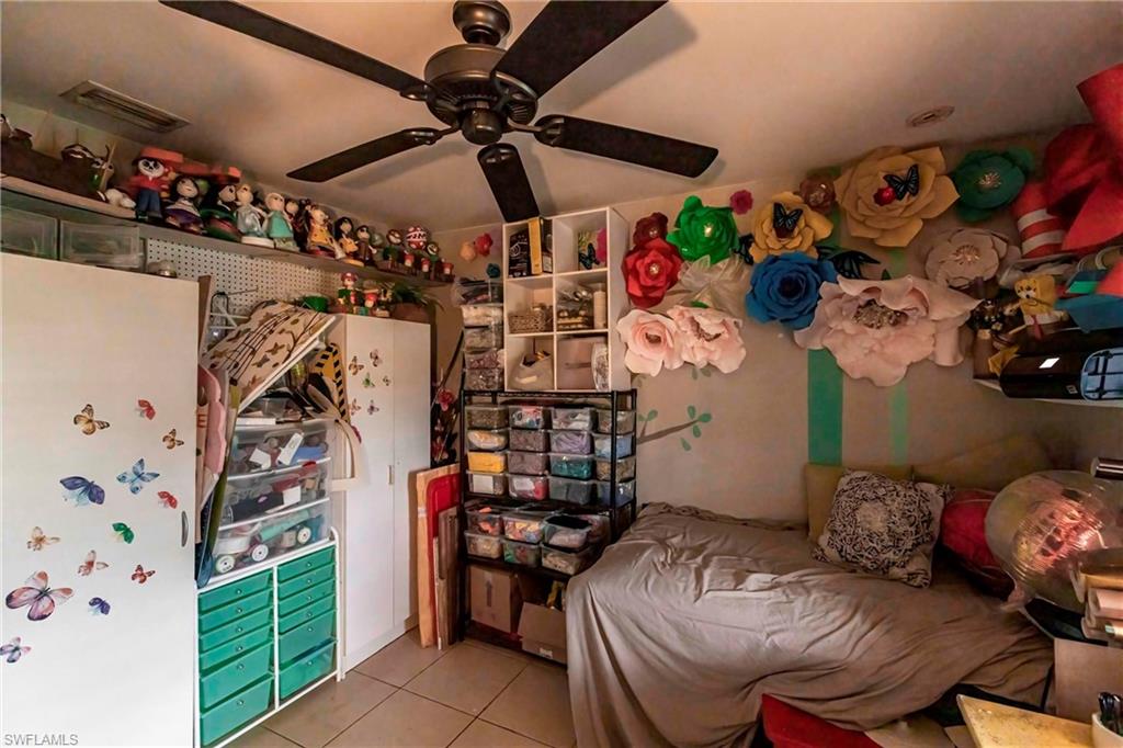 2900 8th Street Southwest Lehigh Acres, FL 33976 - Photo 22 of 32 a room with lots of different furniture