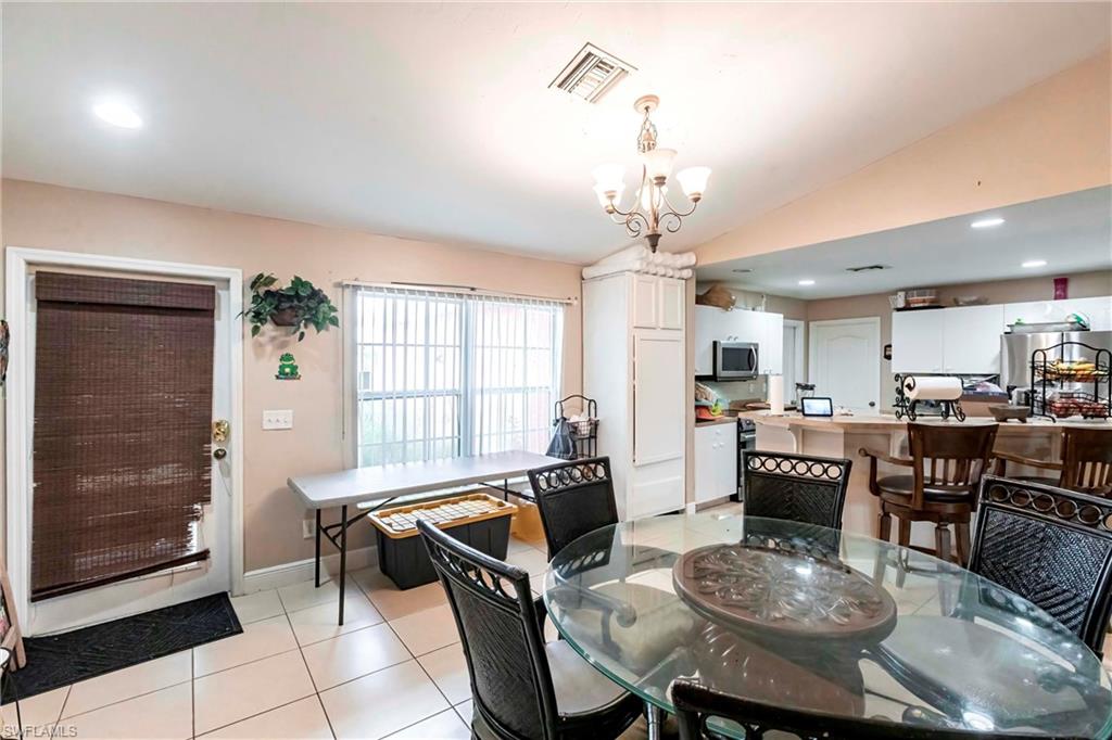2900 8th Street Southwest Lehigh Acres, FL 33976 - Photo 3 of 32 a view of a dining room with furniture