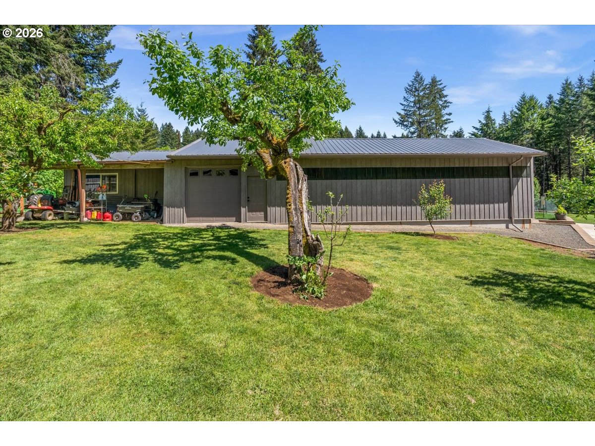 28311 Northwest Nowakowski Road Buxton, OR 97109 - Photo 41 of 48 a house view with a sitting space and garden