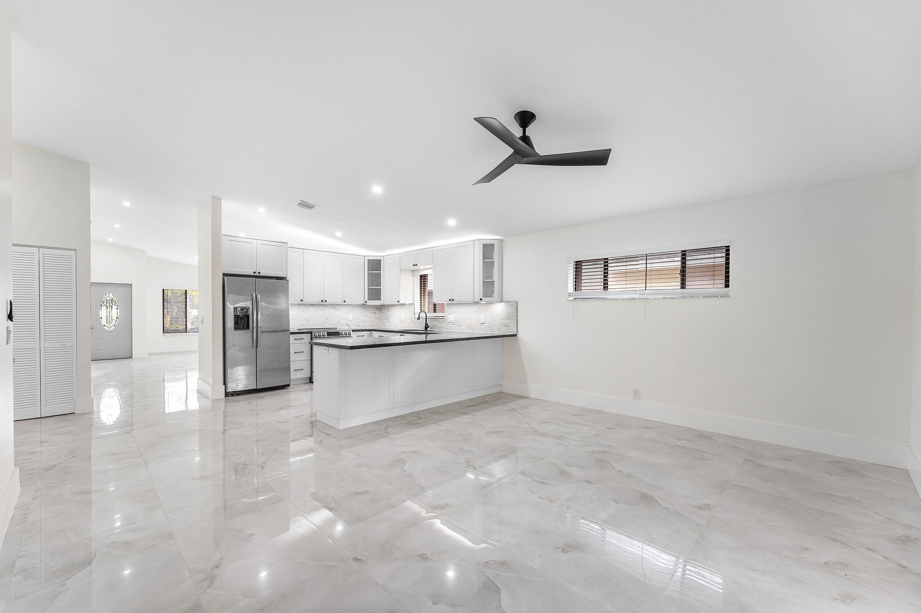 1531 Southwest 102nd Terrace Davie, FL 33324 - Photo 12 of 30 a view of kitchen with stainless steel appliances cabinets a sink and a stove