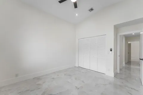 an empty room with a bathroom