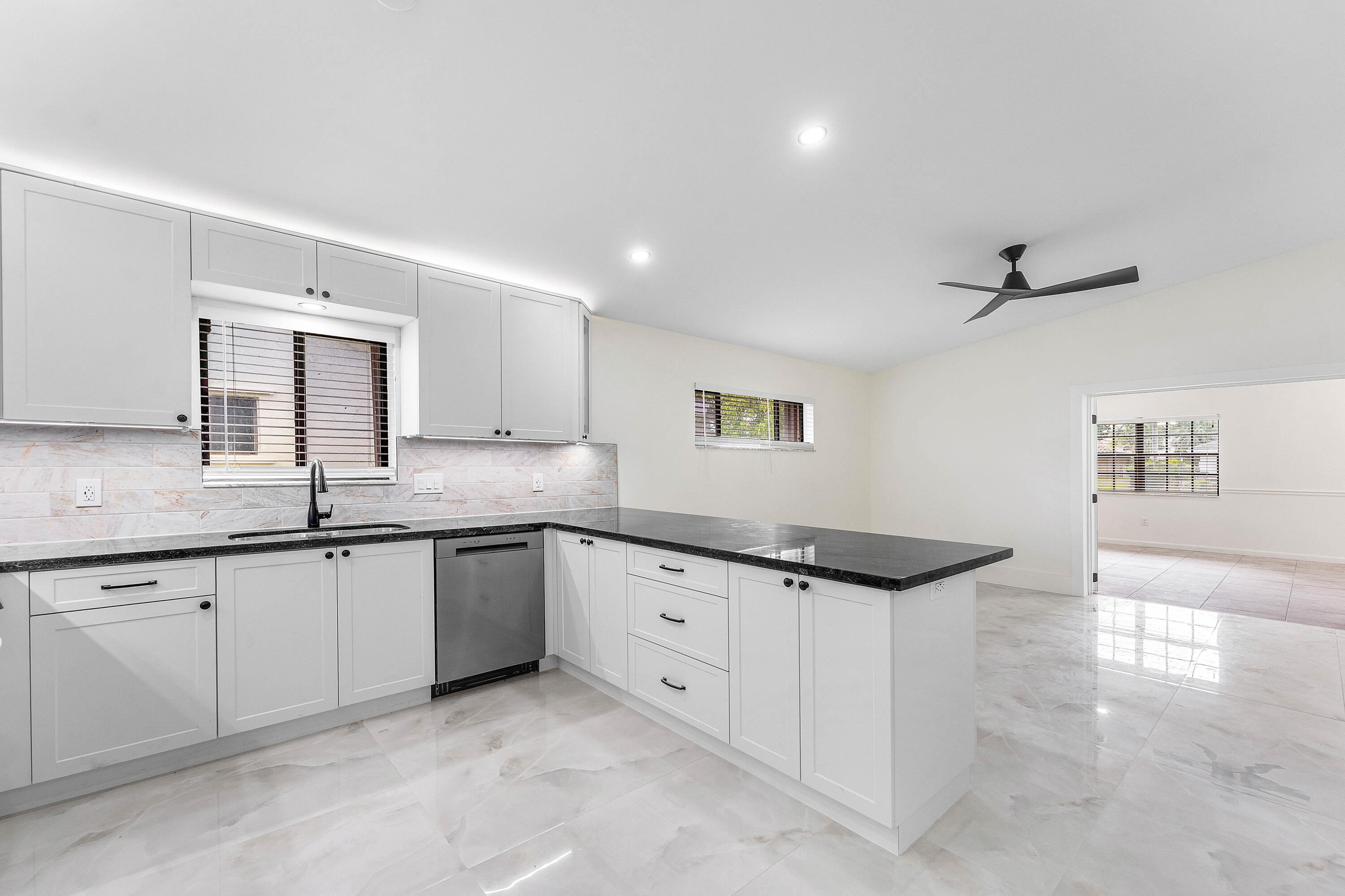 1531 Southwest 102nd Terrace Davie, FL 33324 - Photo 10 of 30 a spacious bathroom with a granite countertop sink a mirror and a bathtub