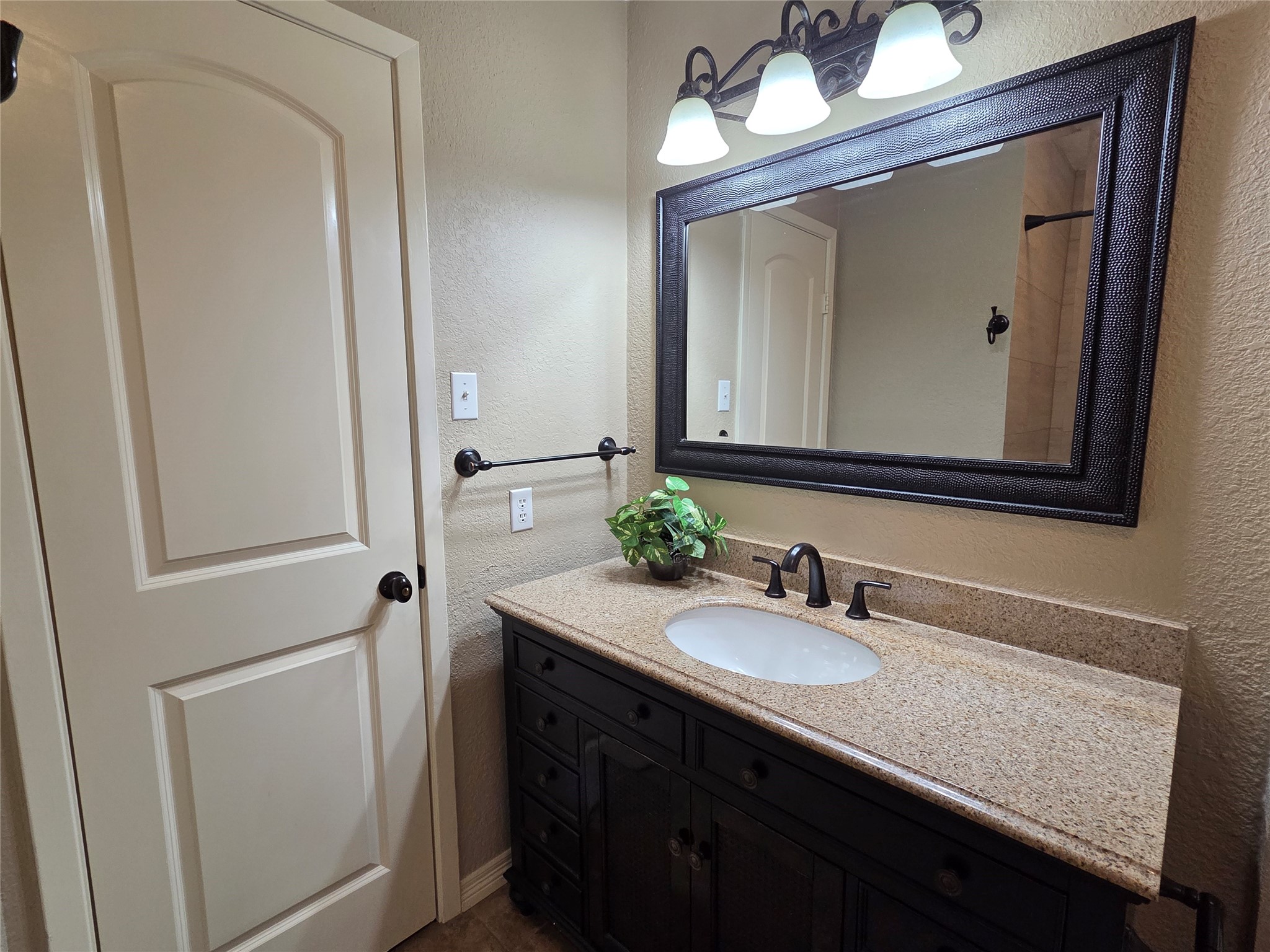 4203 Spinks Creek Lane Spring, TX 77388 - Photo 8 of 11 Full bath has upgraded granite top vanity and large mirror.