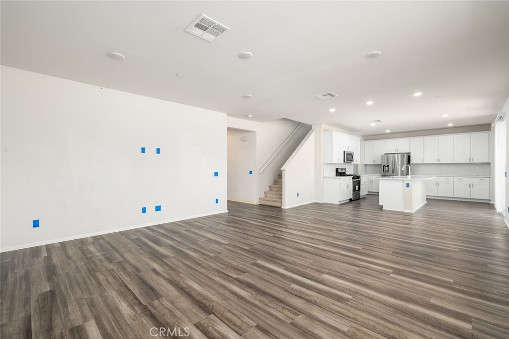 9667 Lasorda Court Riverside, CA 92503 - Photo 12 of 34 a view of empty room with wooden floor