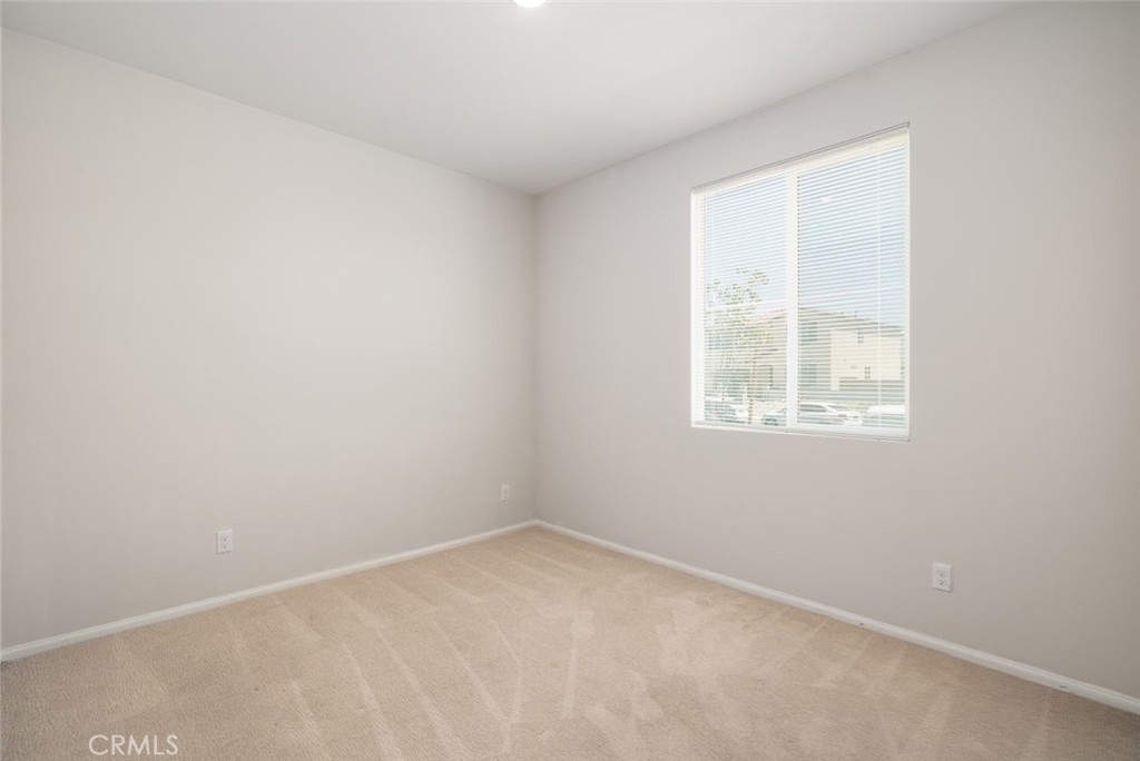 9667 Lasorda Court Riverside, CA 92503 - Photo 13 of 34 an empty room with a window