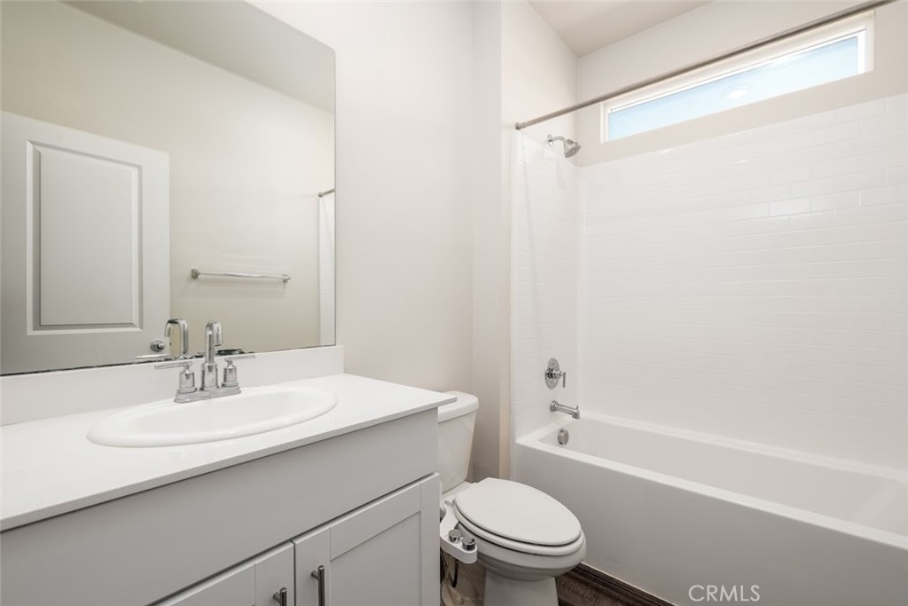 9667 Lasorda Court Riverside, CA 92503 - Photo 14 of 34 a bathroom with a sink a toilet and shower