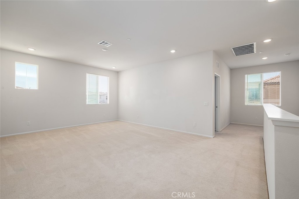 9667 Lasorda Court Riverside, CA 92503 - Photo 16 of 34 an empty room with windows