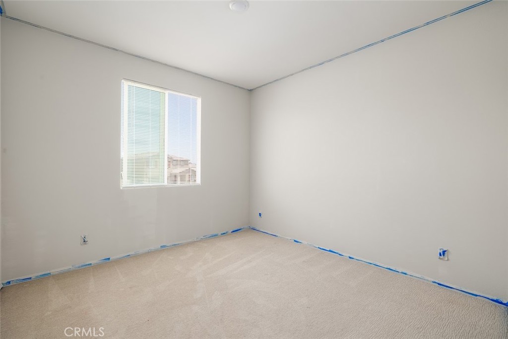 9667 Lasorda Court Riverside, CA 92503 - Photo 18 of 34 an empty room with a window