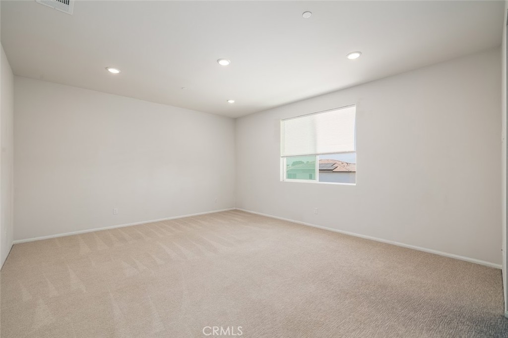 9667 Lasorda Court Riverside, CA 92503 - Photo 22 of 34 an empty room with a window