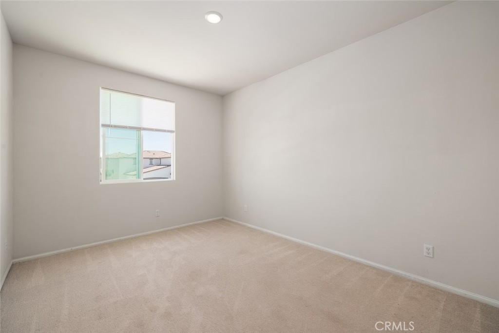 9667 Lasorda Court Riverside, CA 92503 - Photo 28 of 34 an empty room with a window