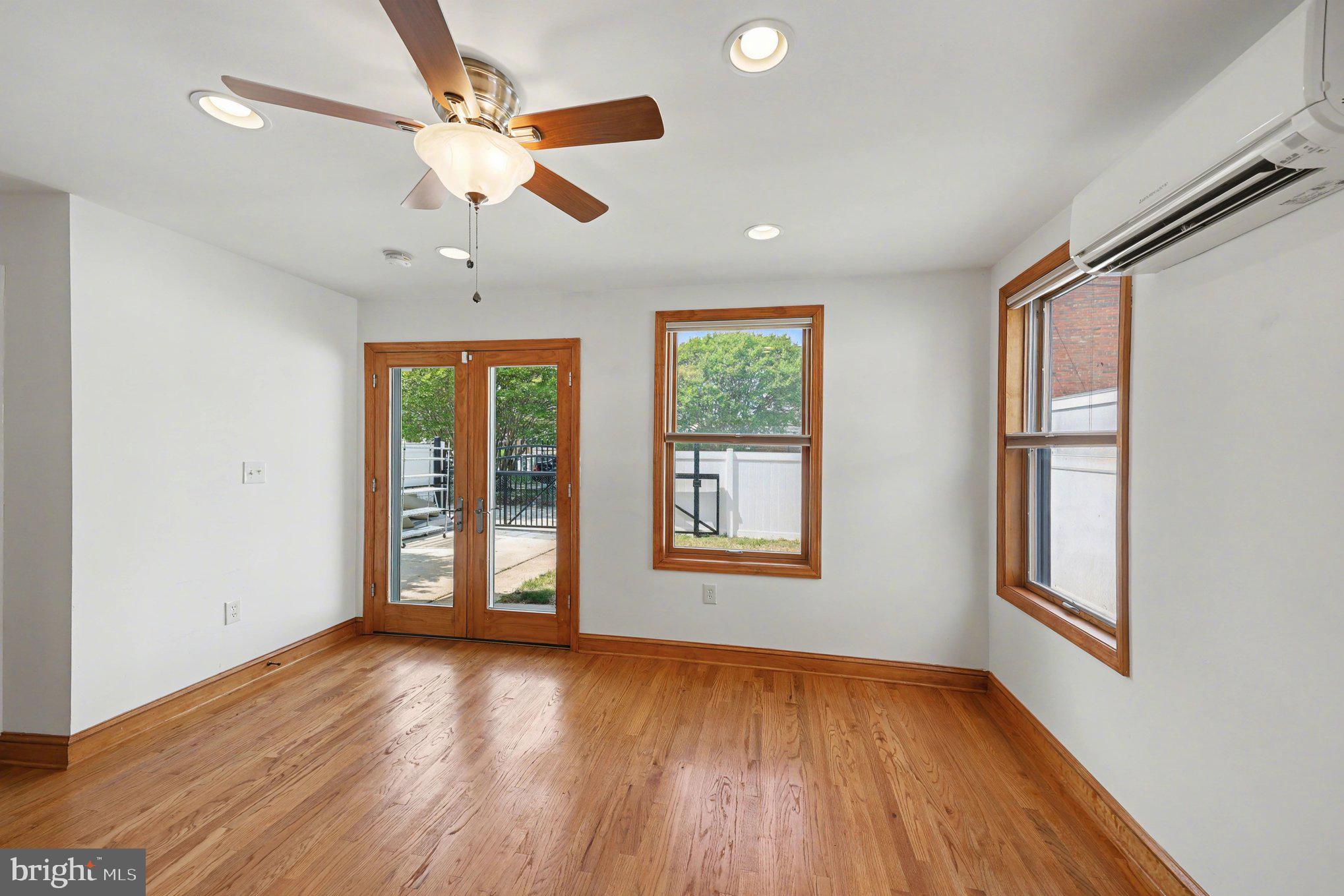 4504 20th Street Northeast Washington, DC 20018 - Photo 13 of 39 wooden floor in an empty room with a window