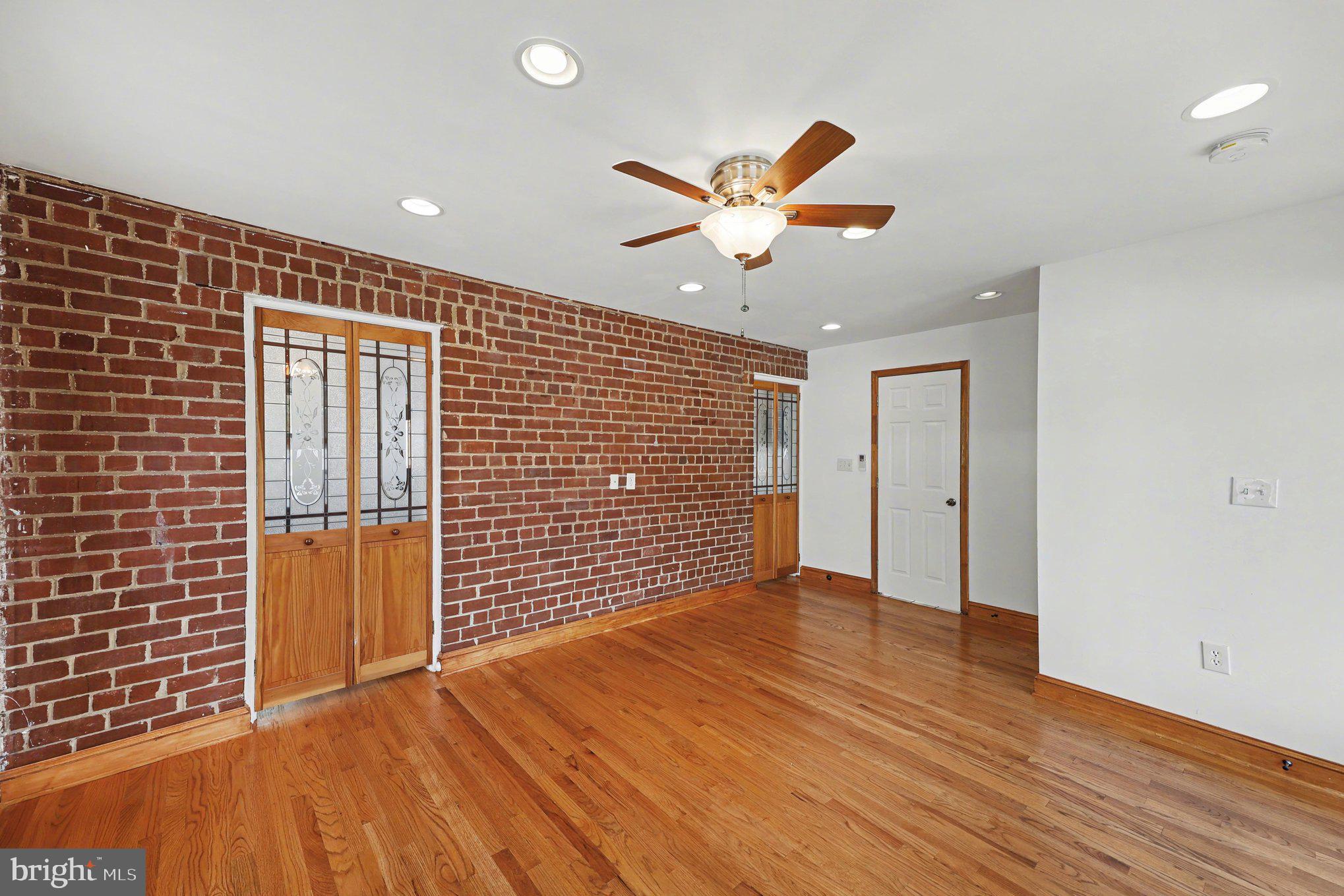 4504 20th Street Northeast Washington, DC 20018 - Photo 14 of 39 a view of an empty room with wooden floor