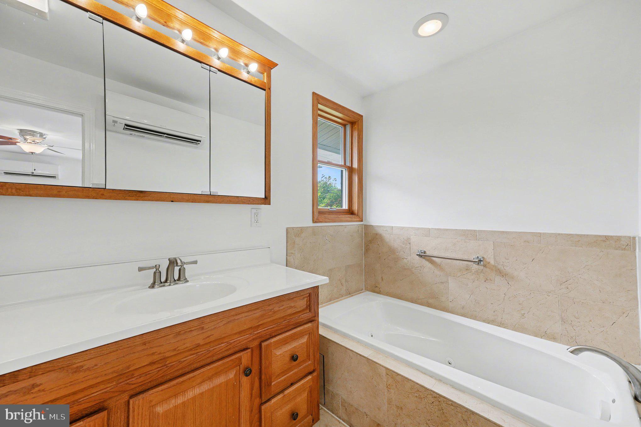 4504 20th Street Northeast Washington, DC 20018 - Photo 21 of 39 a bathroom with a sink and a bathtub