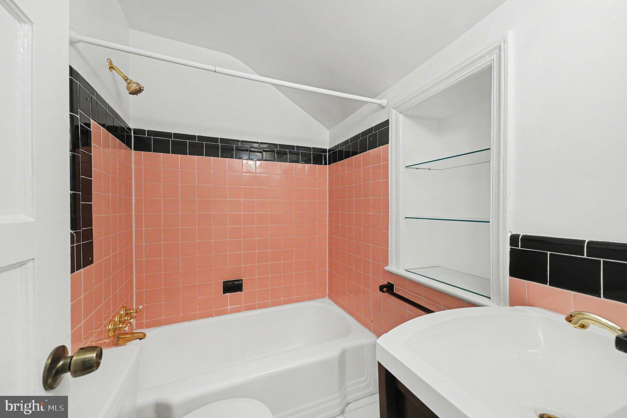 4504 20th Street Northeast Washington, DC 20018 - Photo 25 of 39 a bathroom with a sink and a mirror