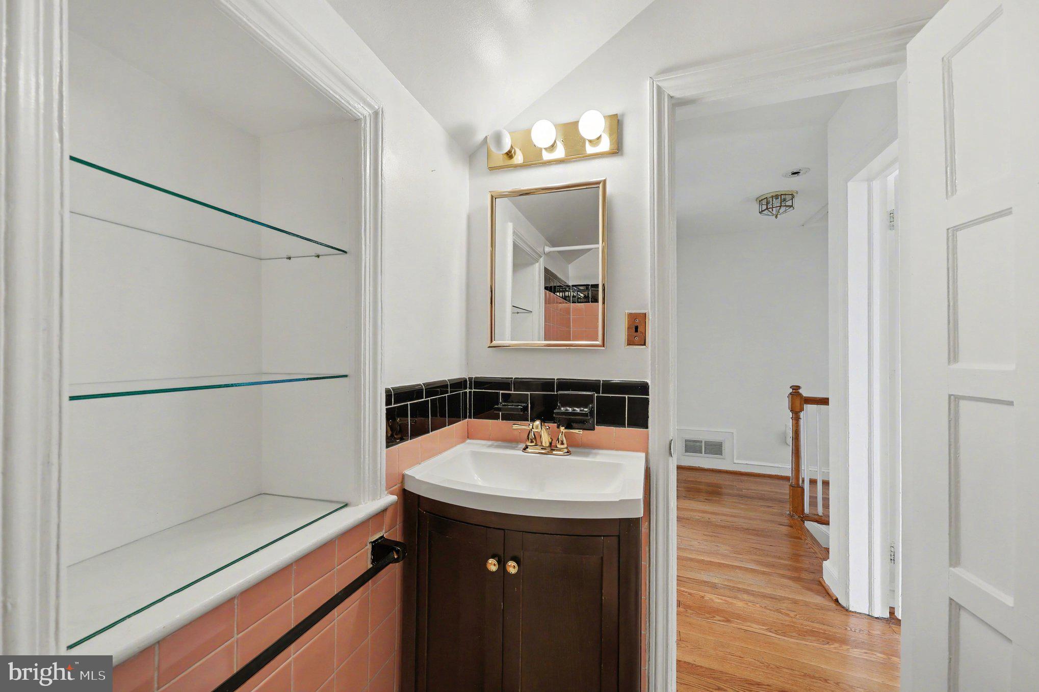 4504 20th Street Northeast Washington, DC 20018 - Photo 26 of 39 a bathroom with a sink and a mirror