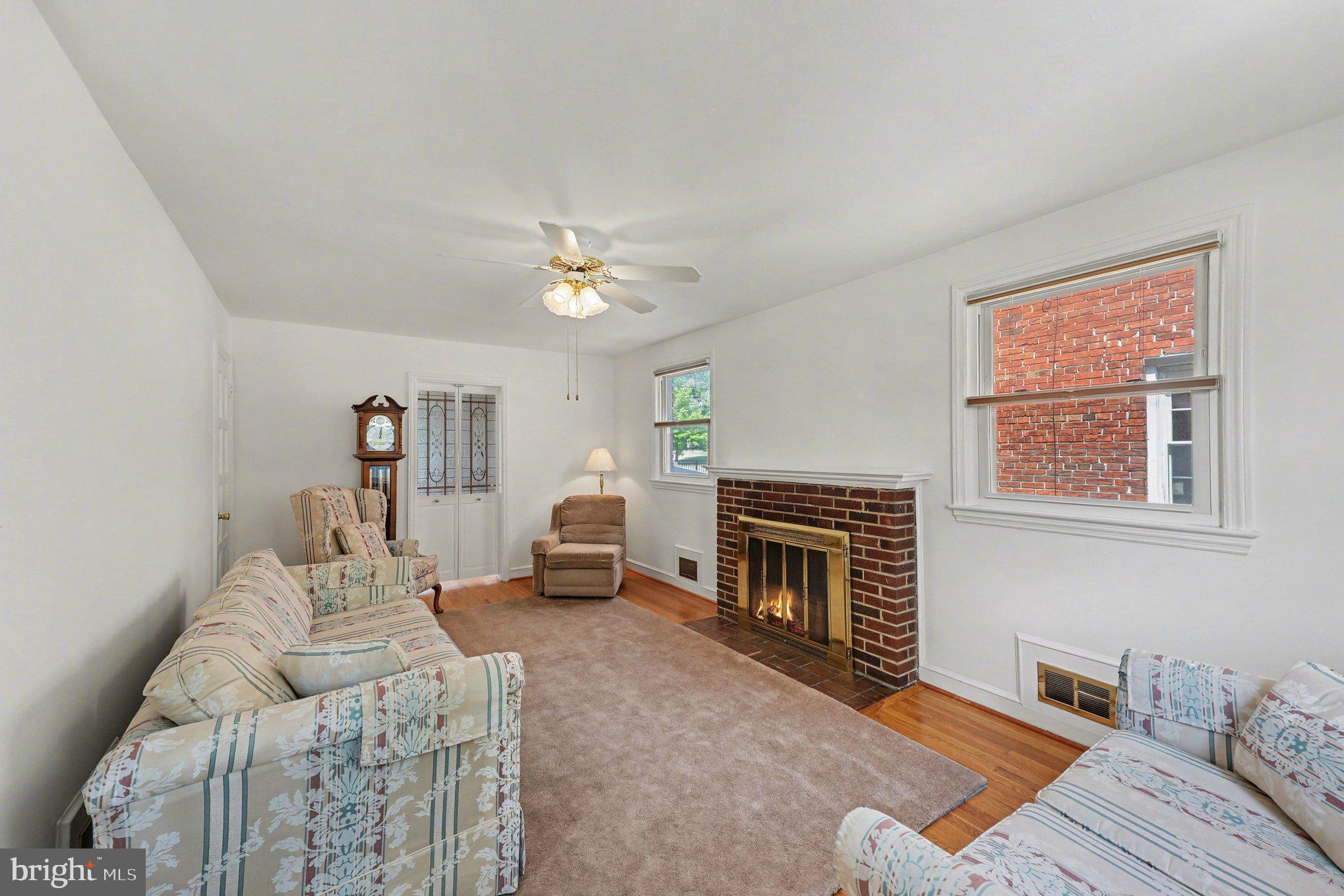 4504 20th Street Northeast Washington, DC 20018 - Photo 3 of 39 a living room with furniture and a fireplace