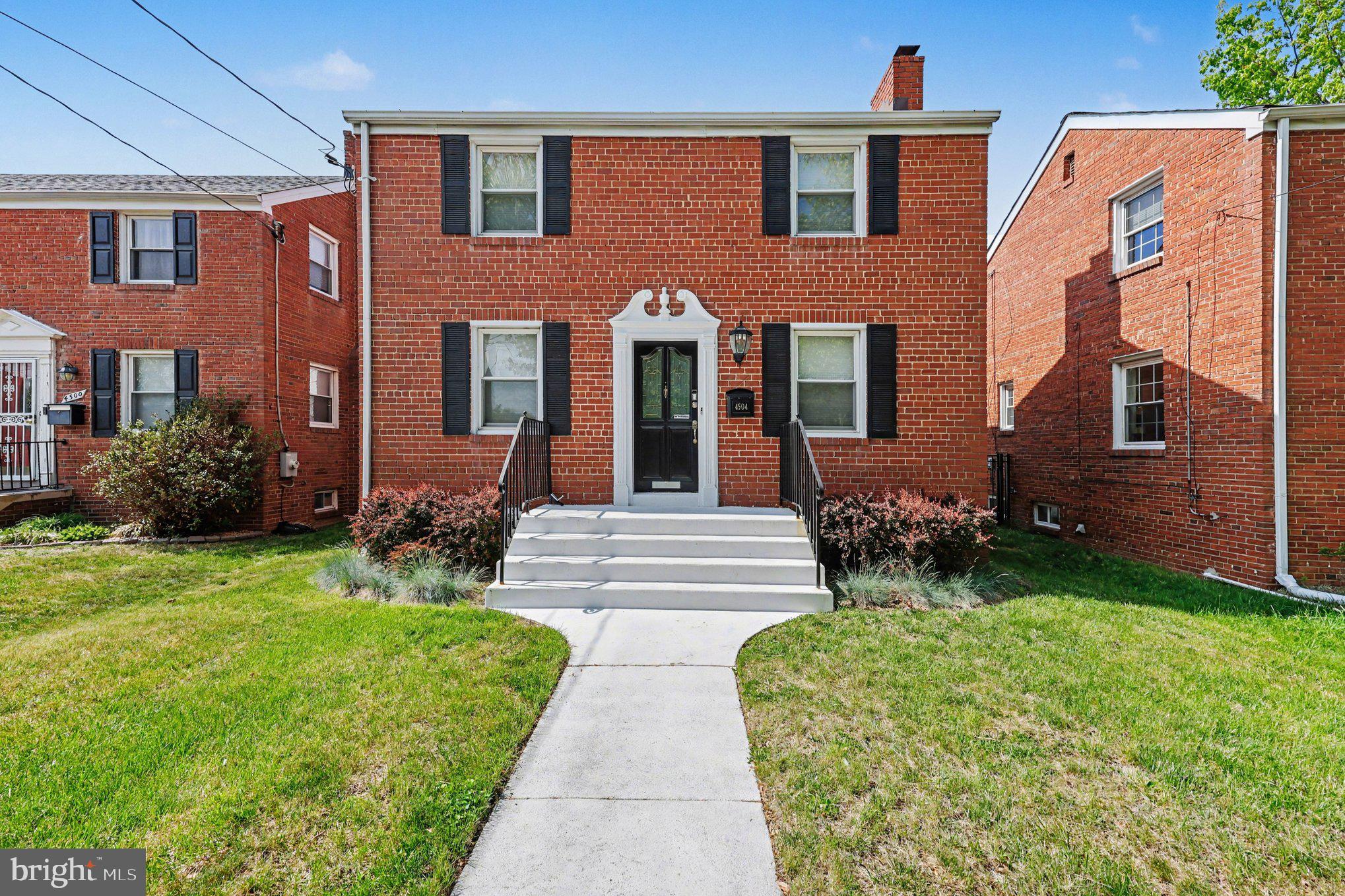 4504 20th Street Northeast Washington, DC 20018 - Photo 34 of 39 a front view of a house with garden