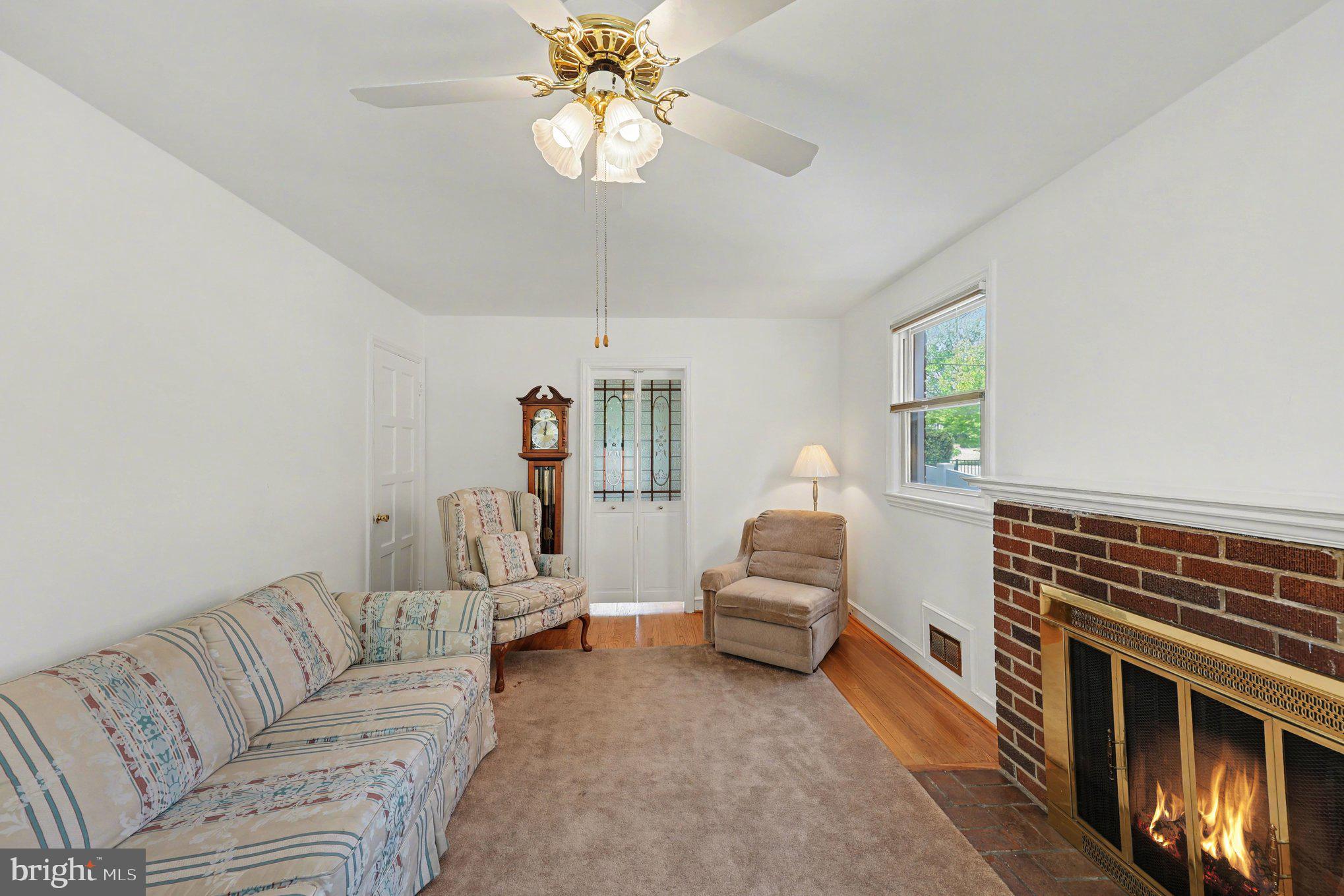 4504 20th Street Northeast Washington, DC 20018 - Photo 4 of 39 a living room with furniture and a fireplace