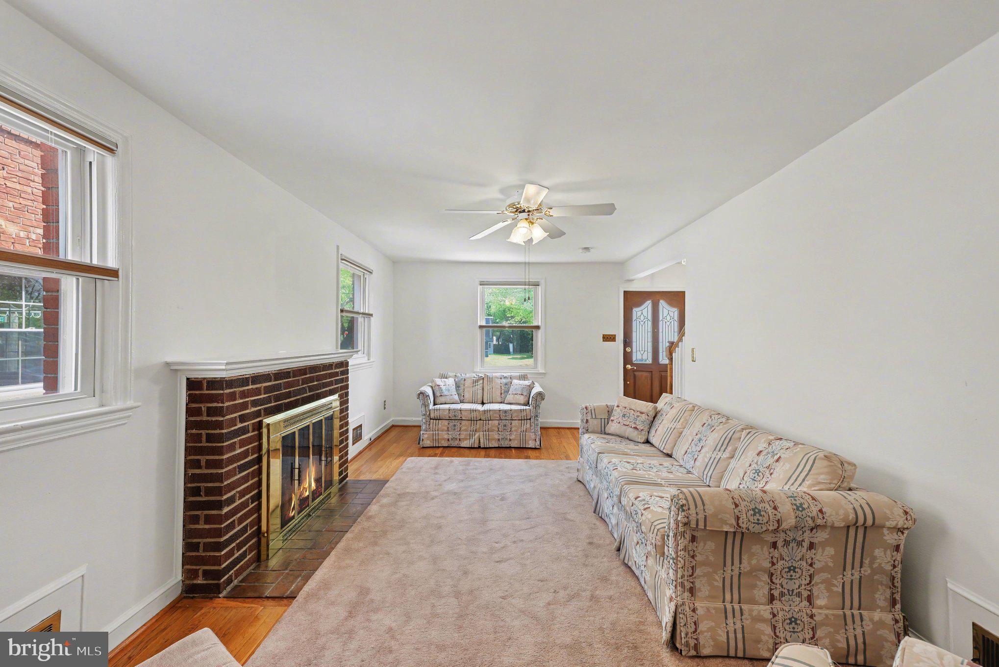 4504 20th Street Northeast Washington, DC 20018 - Photo 5 of 39 a living room with furniture and a fireplace