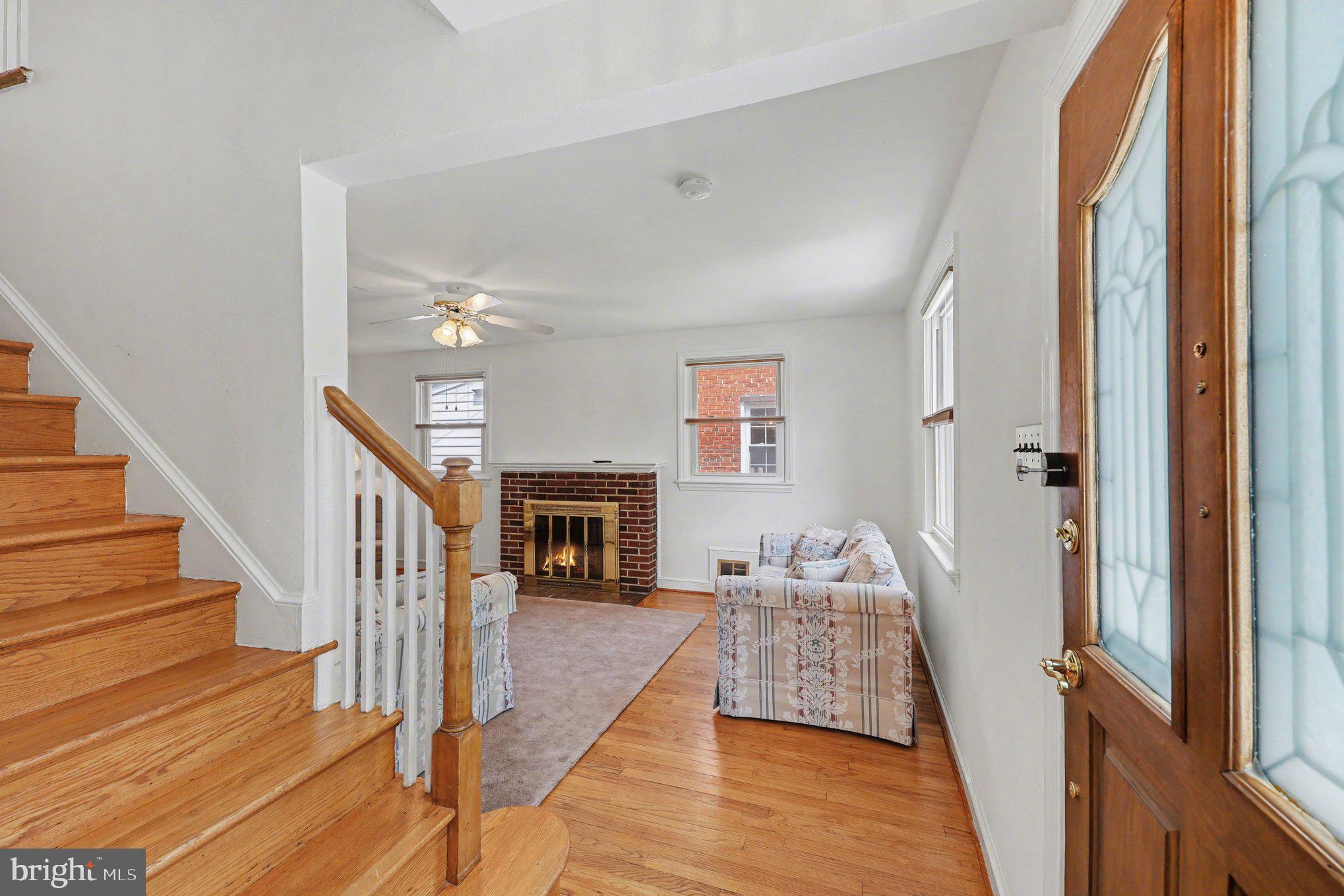 4504 20th Street Northeast Washington, DC 20018 - Photo 6 of 39 a living room with furniture and a fireplace