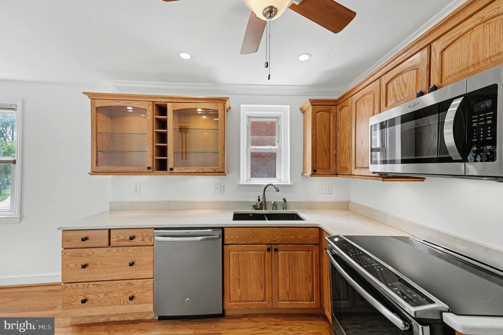 4504 20th Street Northeast Washington, DC 20018 - Photo 10 of 39 a kitchen with stainless steel appliances granite countertop a sink and a stove