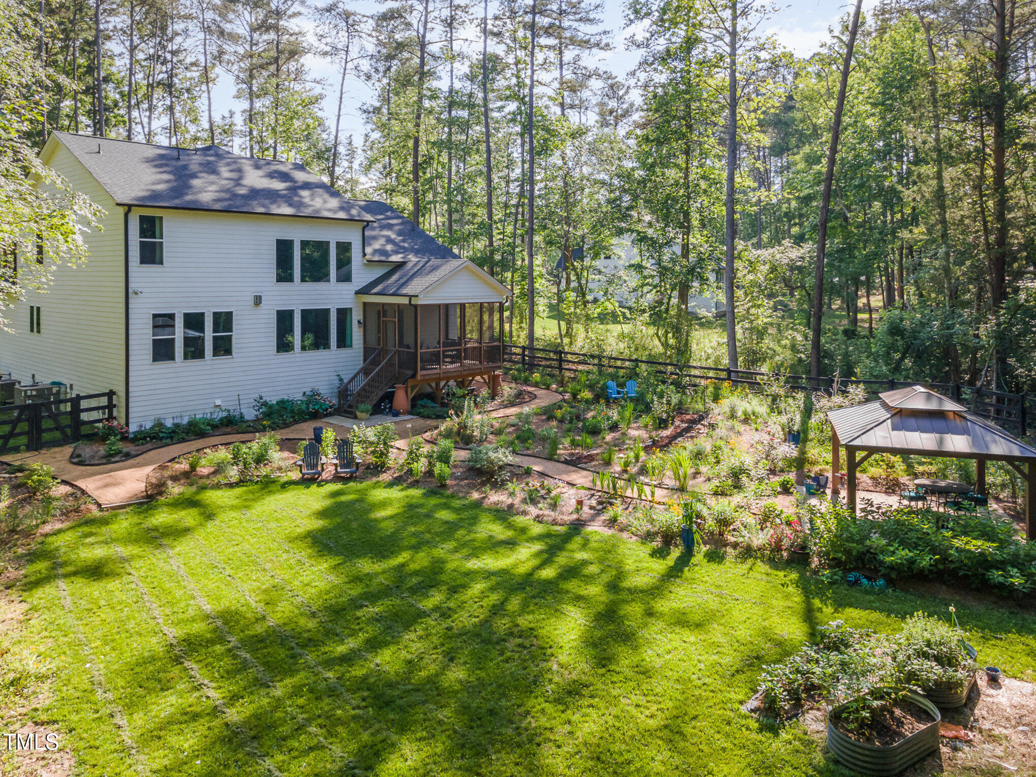 a house with swimming pool in front of it