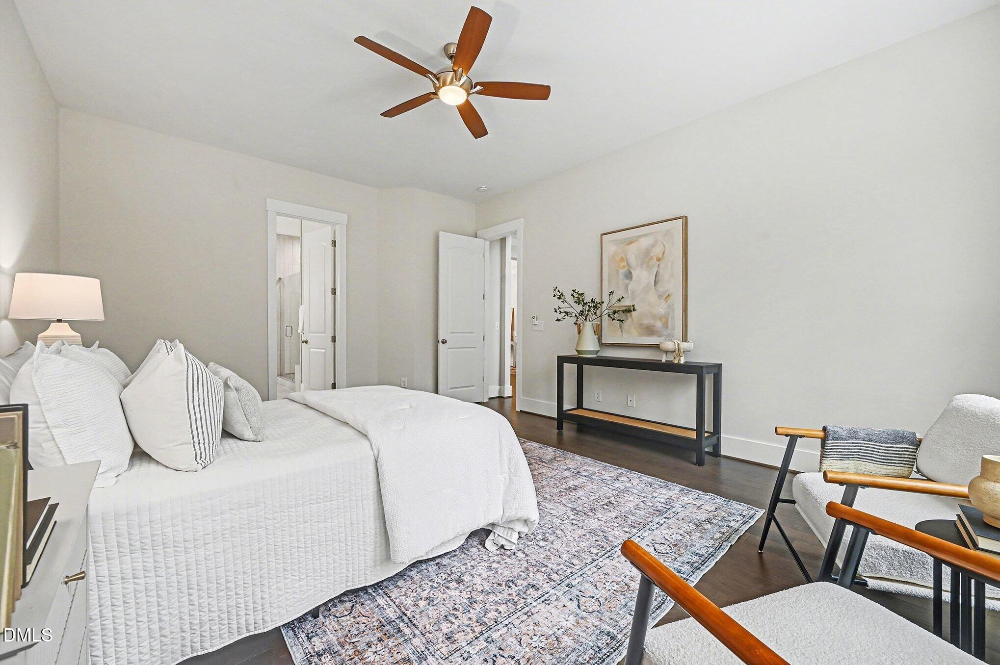 1017 Fortune Lane Mebane, NC 27302 - Photo 12 of 84 a bedroom with a bed a chandelier and a dresser