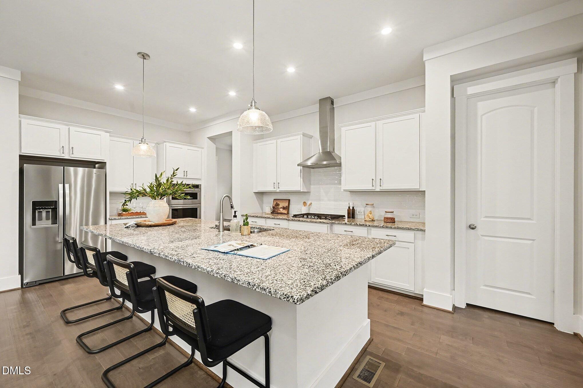 1017 Fortune Lane Mebane, NC 27302 - Photo 14 of 84 a kitchen with kitchen island granite countertop a sink a center island and appliances