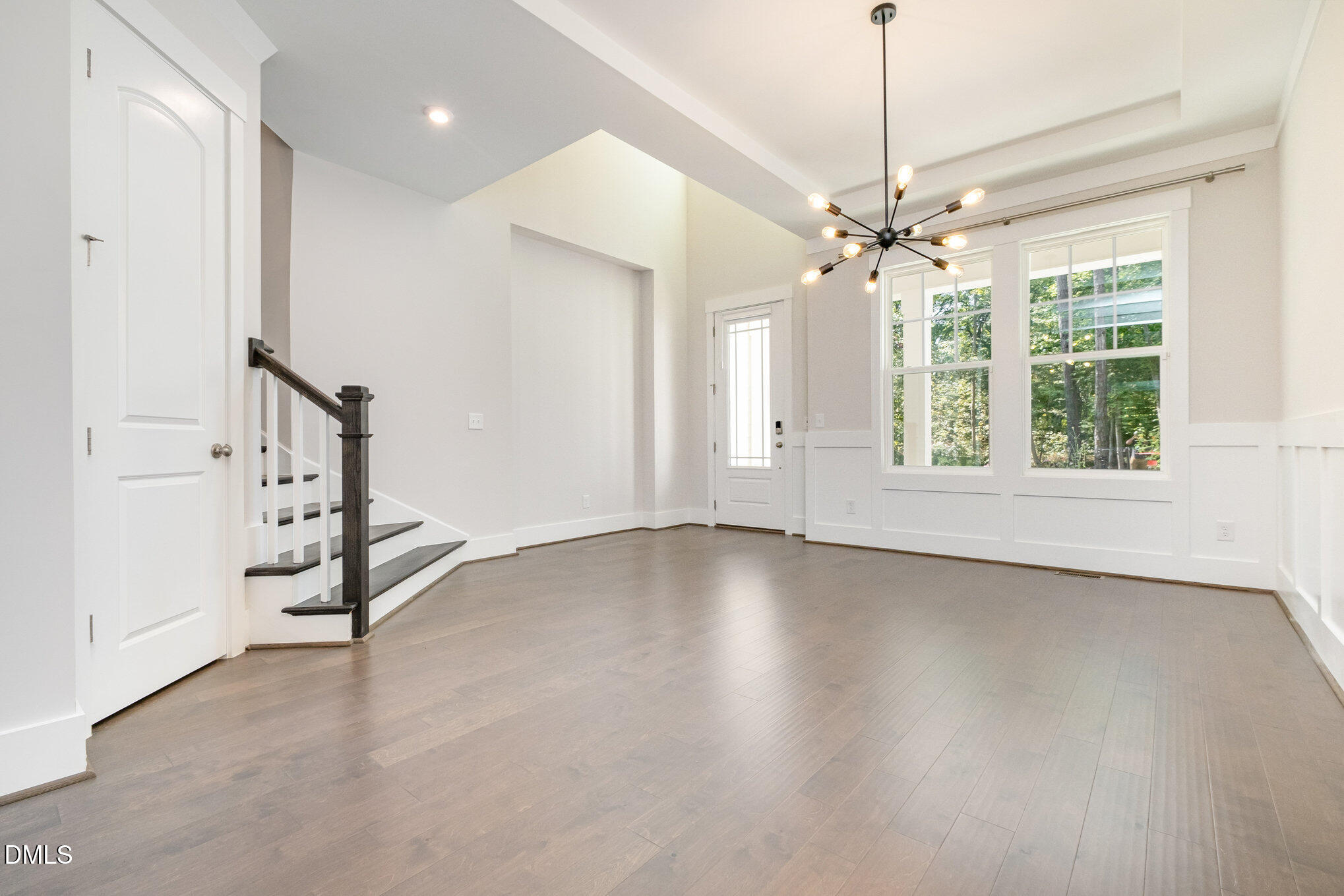 1017 Fortune Lane Mebane, NC 27302 - Photo 22 of 84 a view of an empty room with chandelier fan and fire place